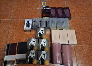Parfumuri contrafăcute vândute într-un magazin din localitatea Roșiori